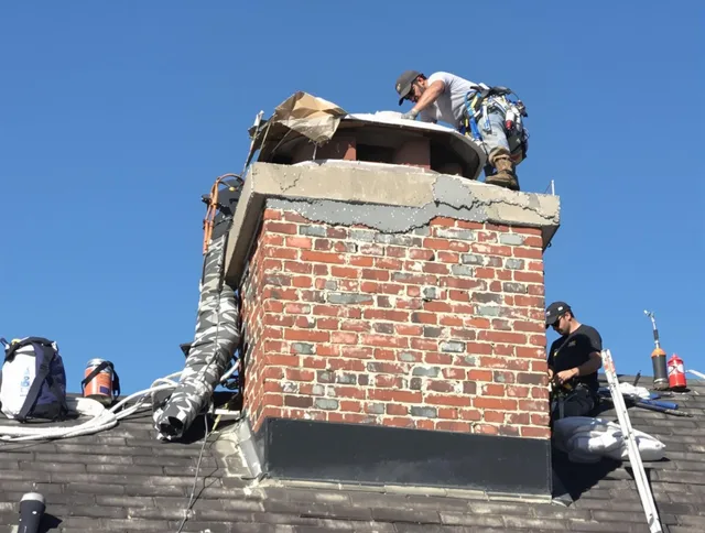 Stafford Chimney Sweep installing a custom chimney crown in Stafford, CT