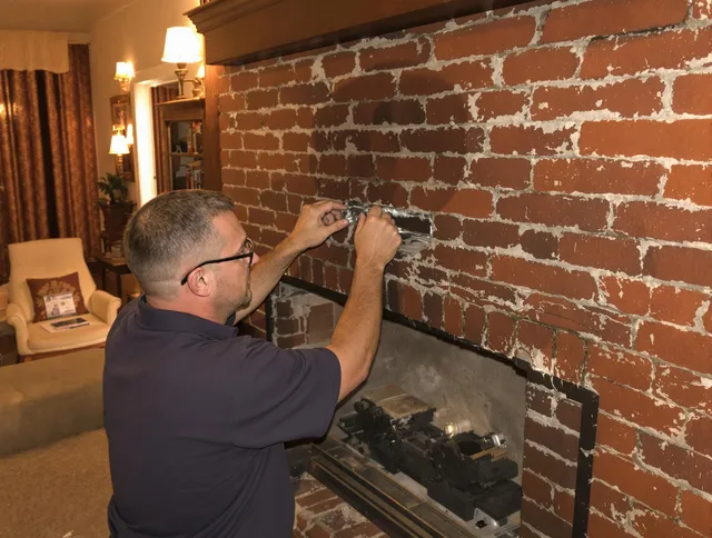 Stafford Chimney Sweep expert fixing a fireplace in Stafford, CT